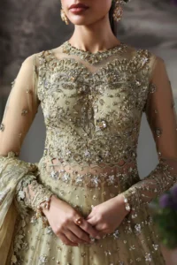 Close-up of hand embroidery and sequin work on pista green organza lehenga panels
