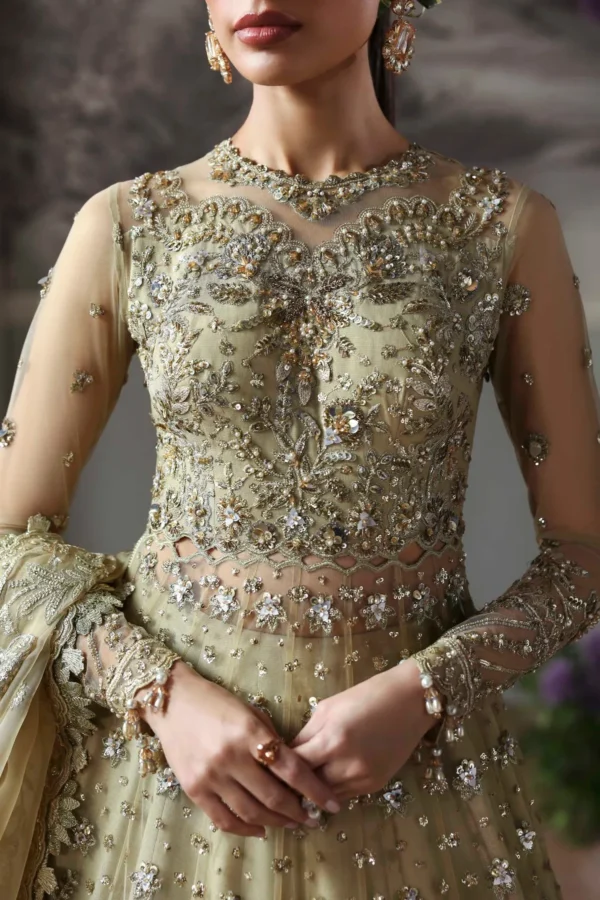 Close-up of hand embroidery and sequin work on pista green organza lehenga panels