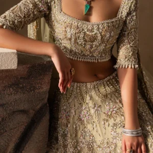 Pakistani bridal lehenga in pastel gold organza – front view