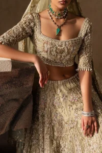 Pakistani bridal lehenga in pastel gold organza – front view
